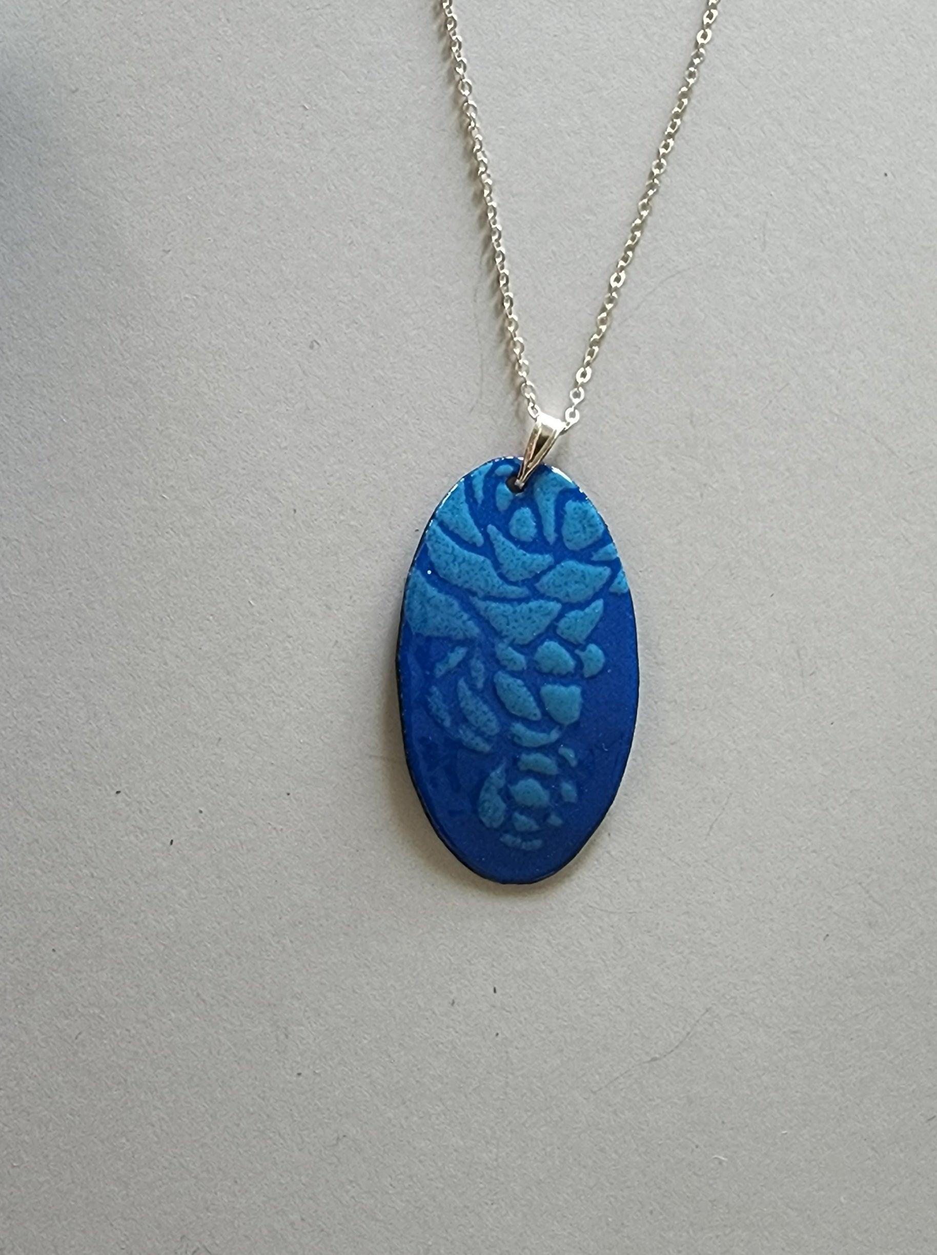 Handmade Womans Two Tone Blue Enameled Copper Oval Necklace with Raised Floral Pattern and Sterling Silver Chain - Gilded Heart Designs